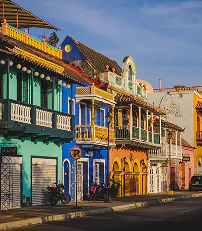 A vibrant building featuring numerous windows and balconies, showcasing a colorful facade.